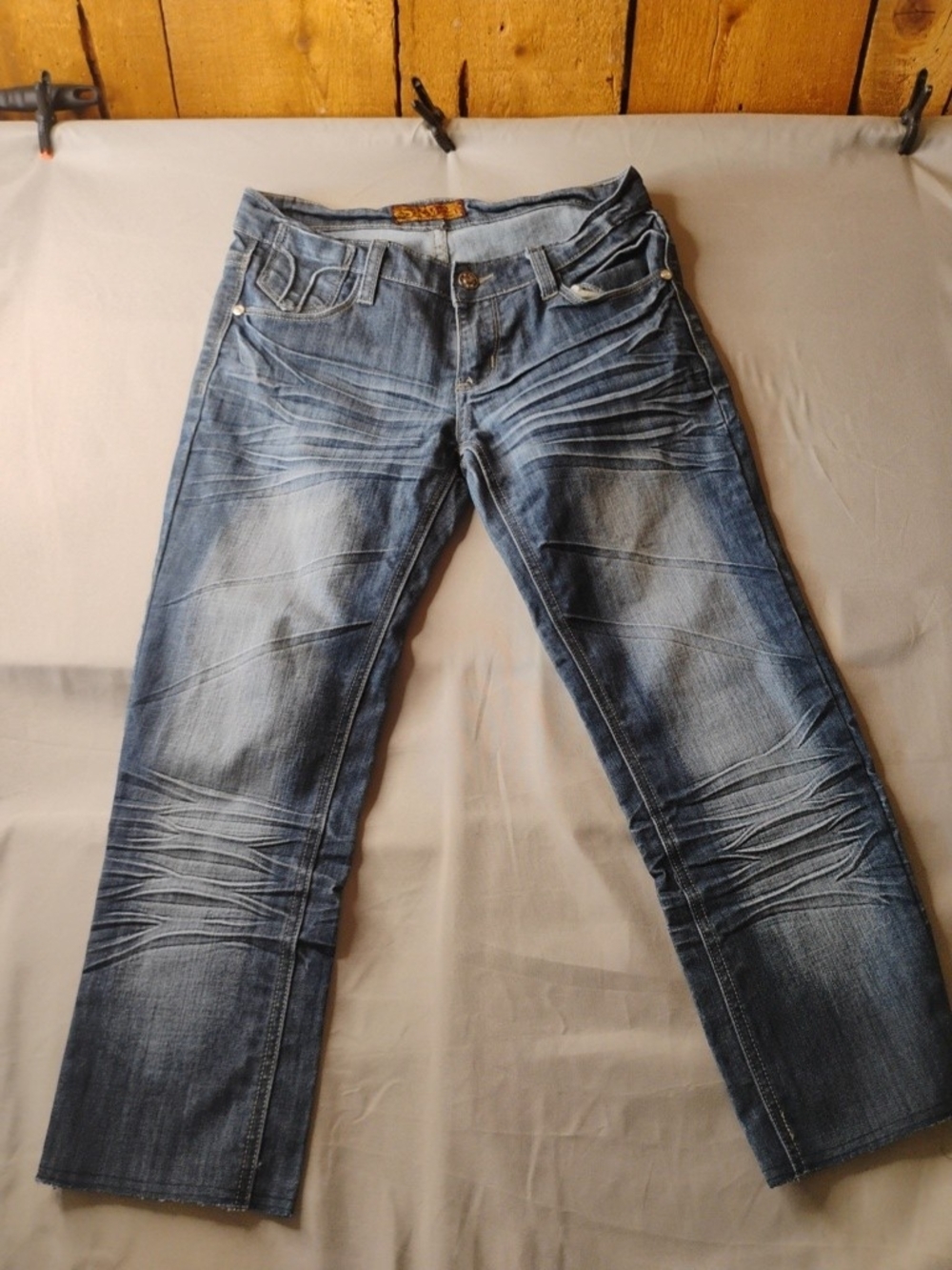 Straight Leg Women’s Washed Blue Jeans with Faded Detailing